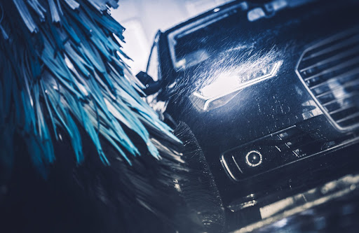 luxury car being washed at a car wash business