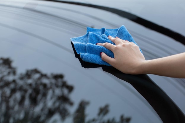 Car Wash Cleaning with a Blue Microfiber Towel