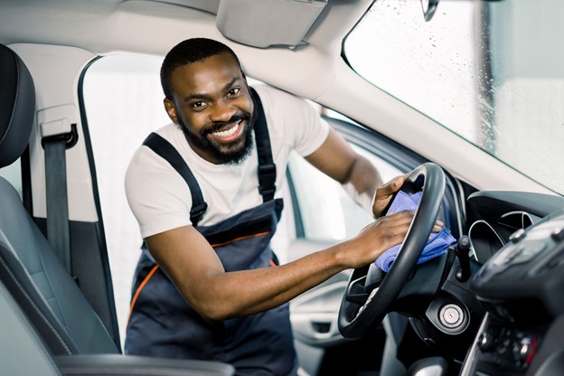 Happy Man Working at a Car Wash